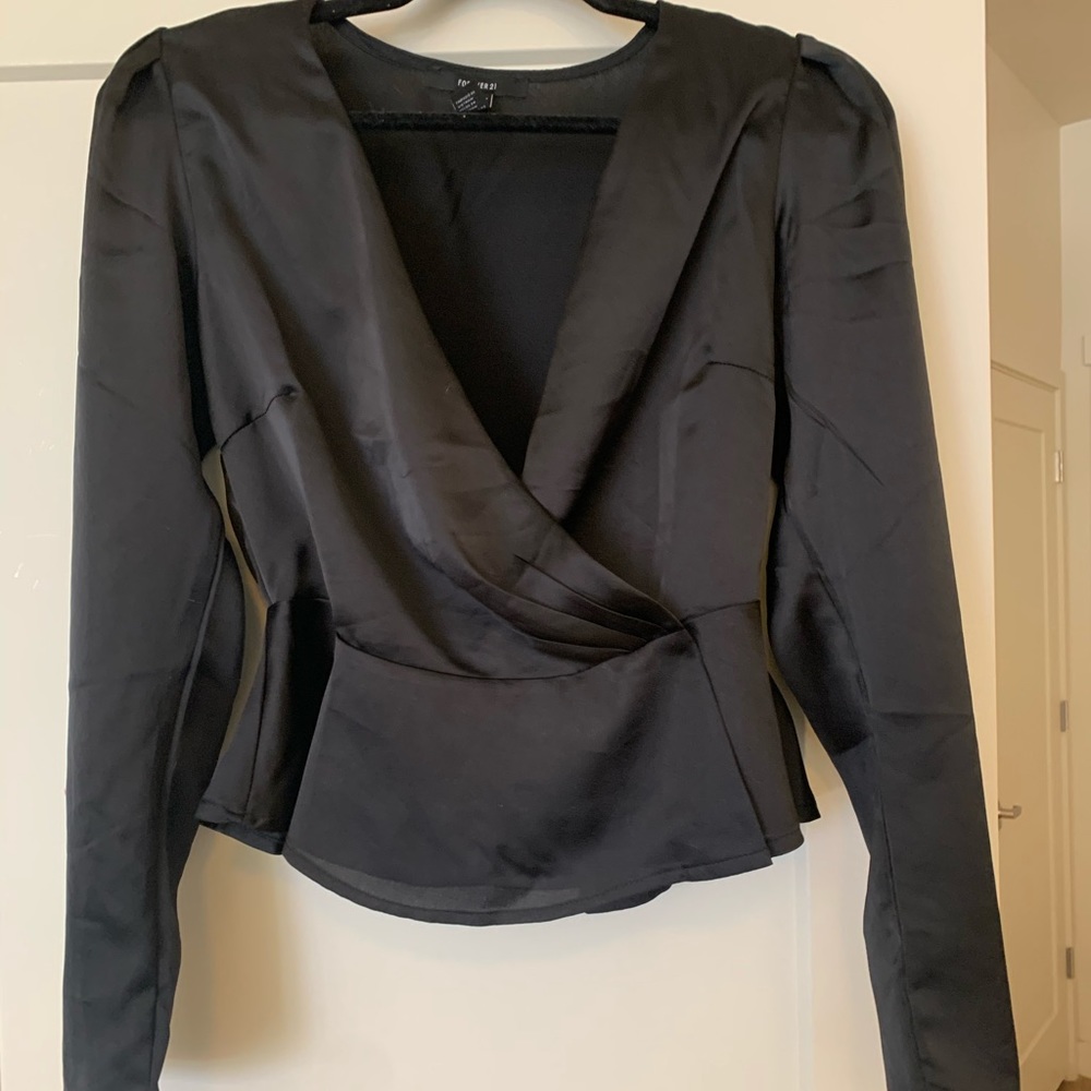 Silky button across top. Long sleeve.